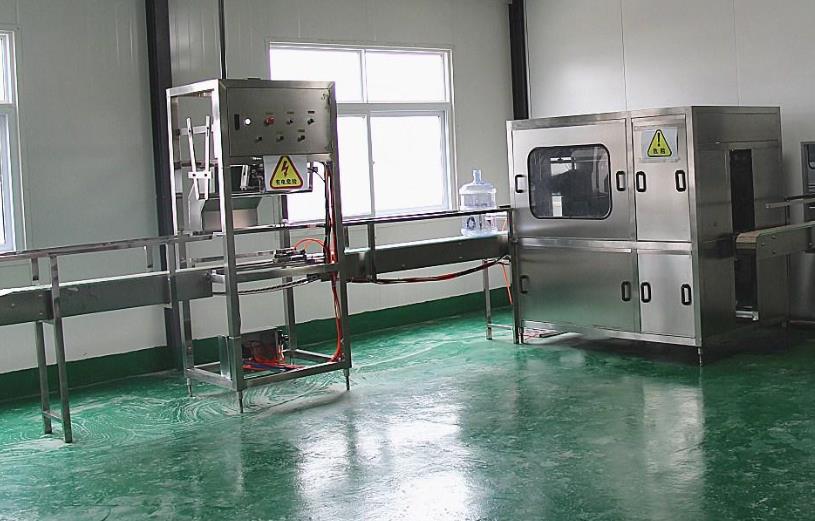 大桶水拔盖设备_郑州大桶水设备厂家